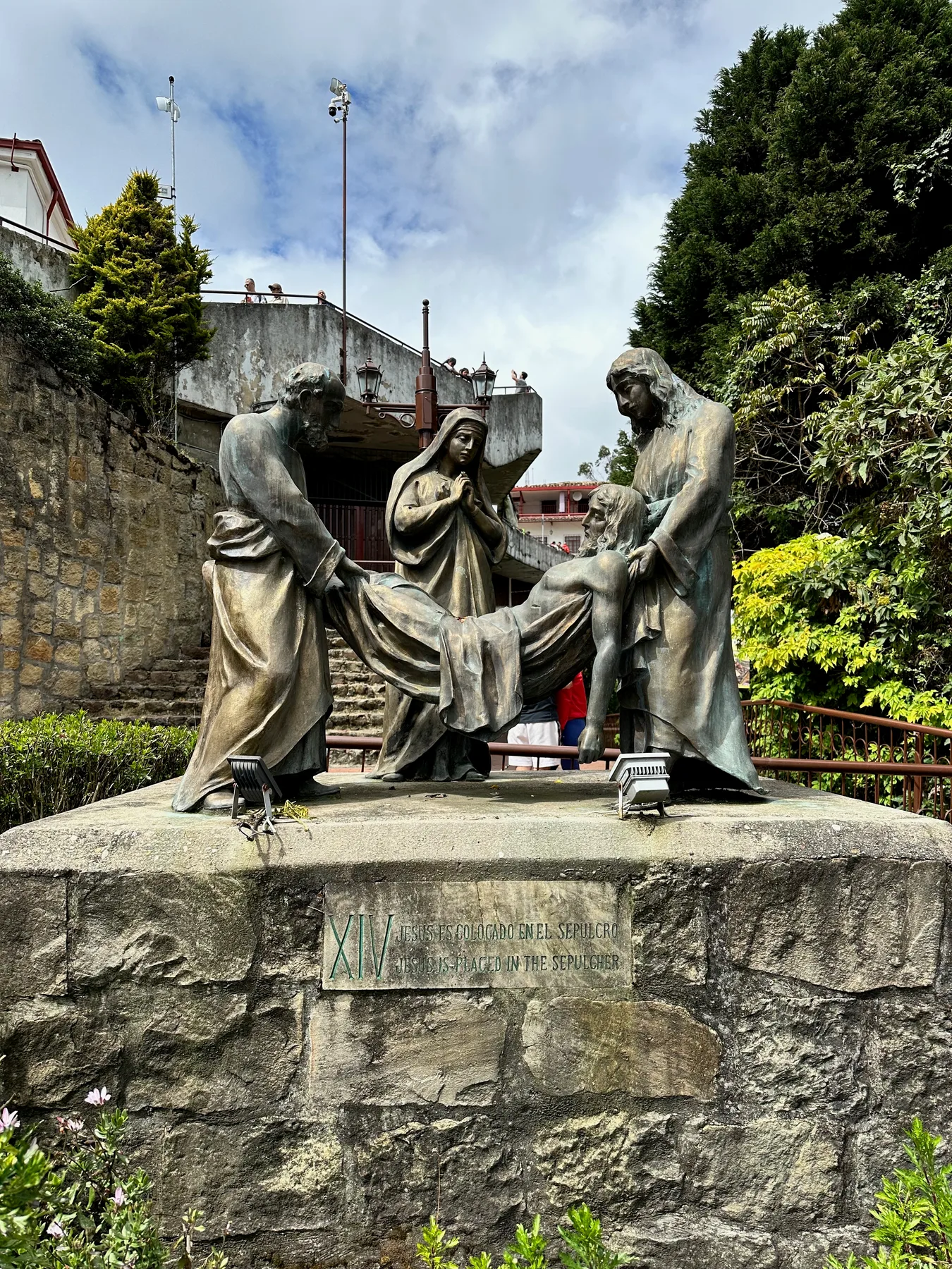 Sculpture beside a garden and stone steps