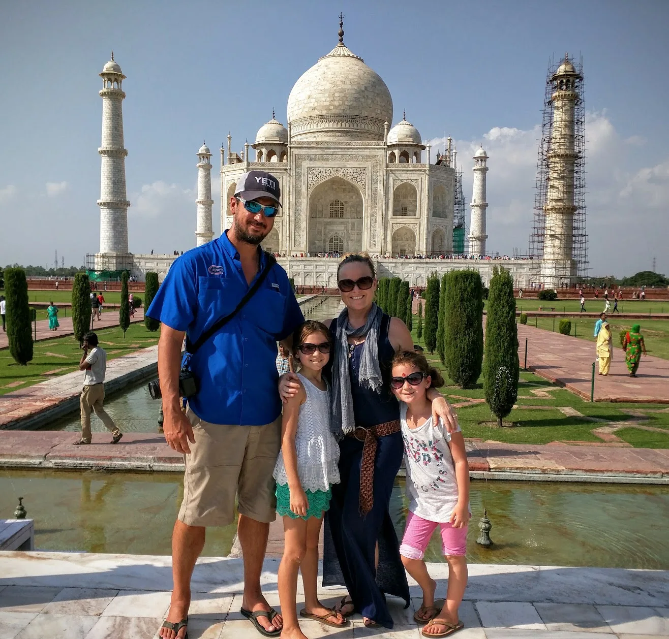 Family of four in front of the Taj Mahal