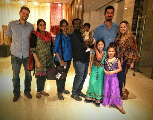 Family and friends posing together at the end of the India trip