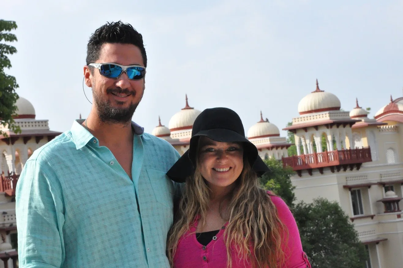 Josh and Morgan in front of a palace-style building