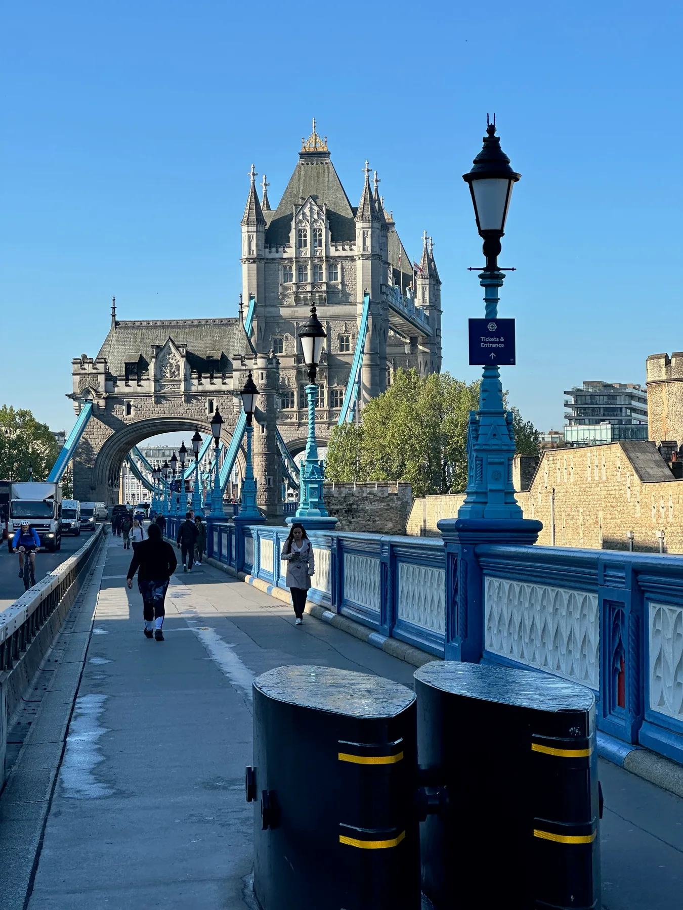 Walking across Tower Bridge on a clear morning