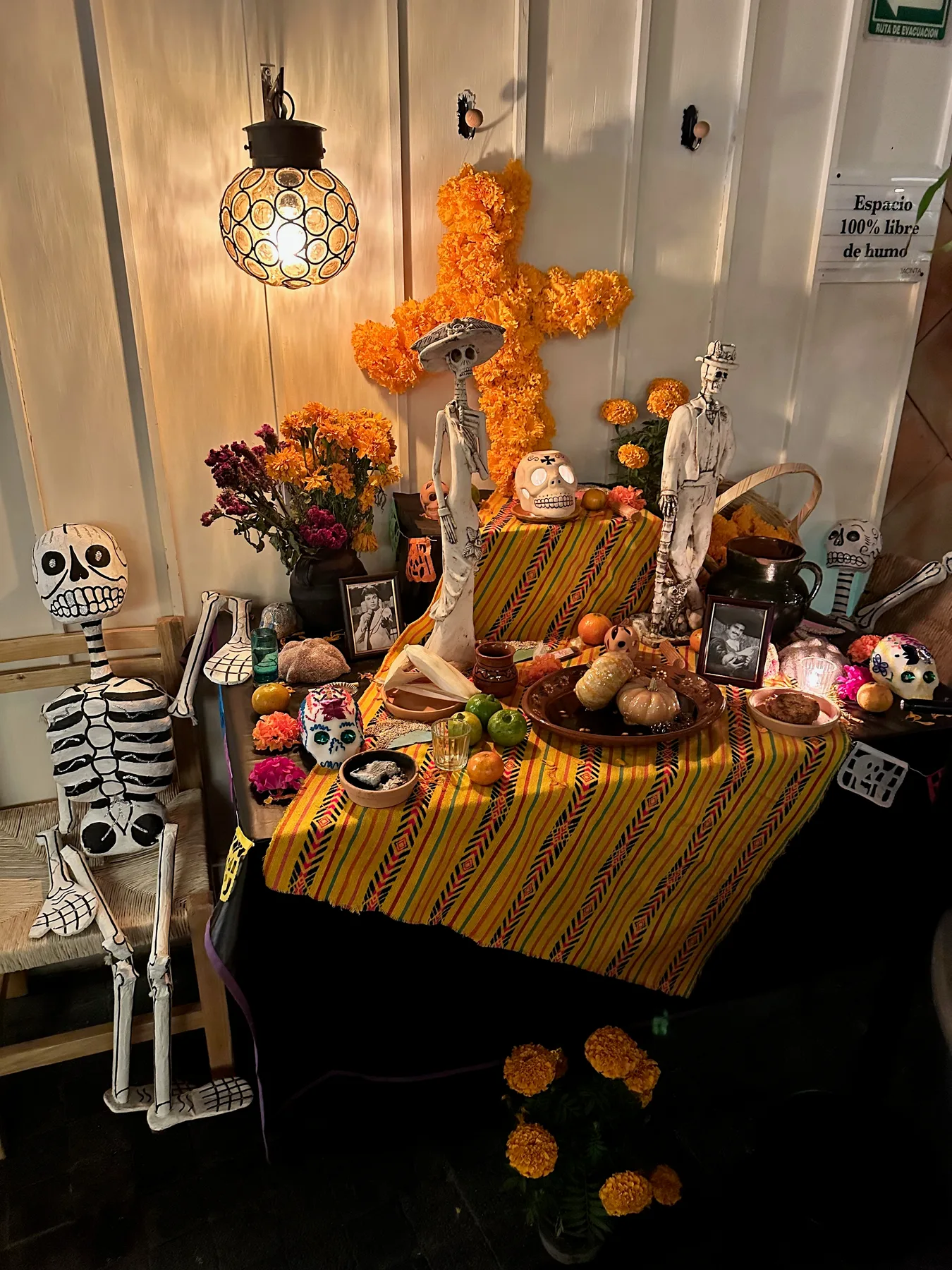 Colorful display with flowers and skeleton figures
