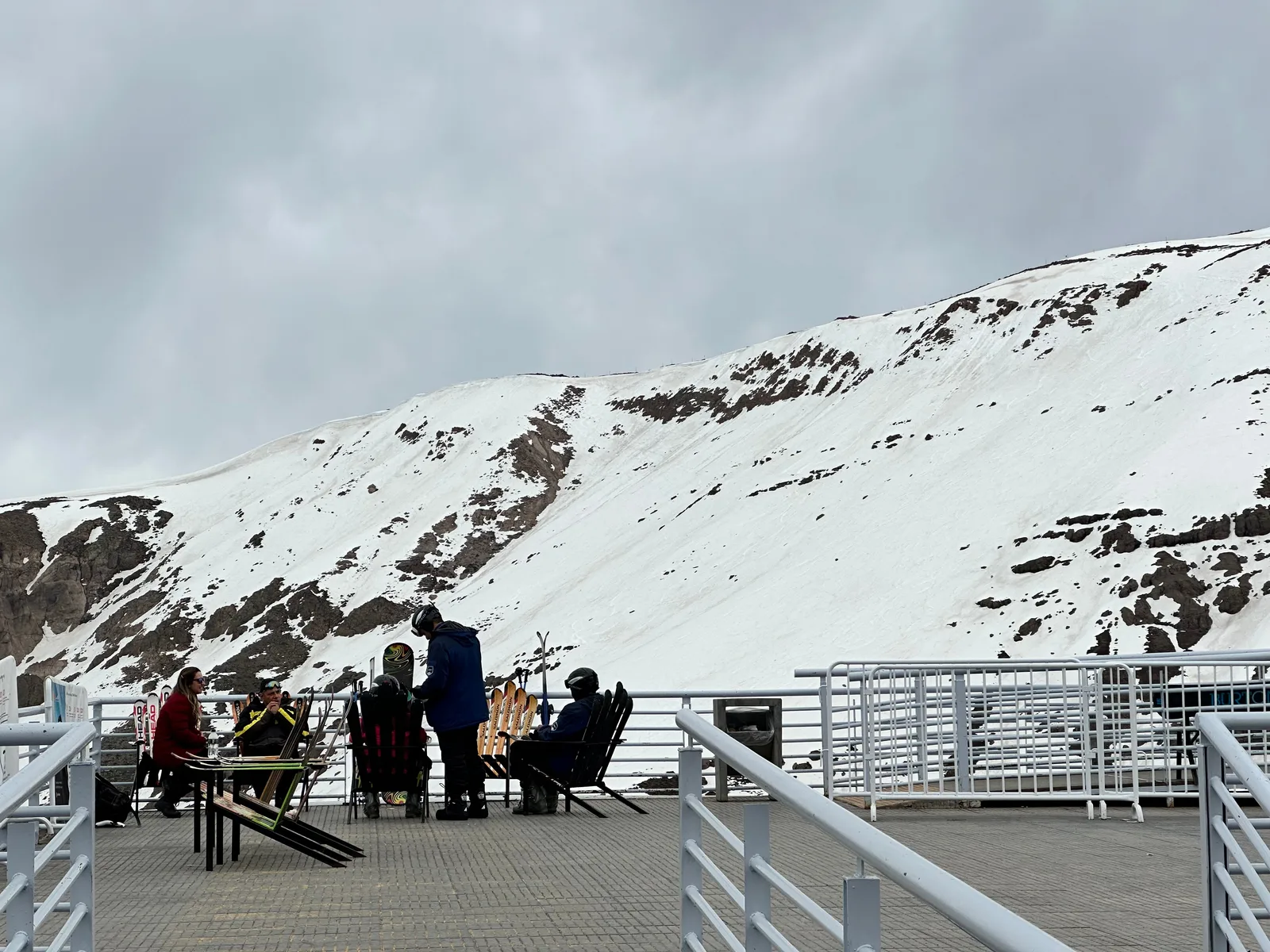 Snow-covered mountains beyond a viewing terrace