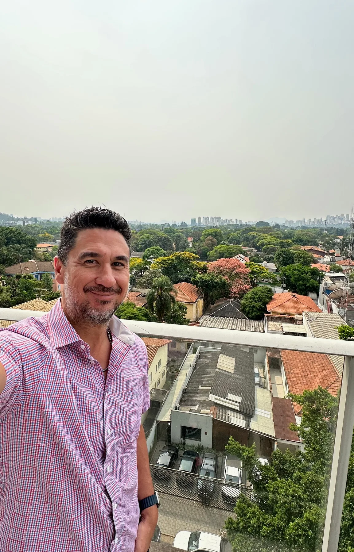 Portrait on a balcony overlooking São Paulo