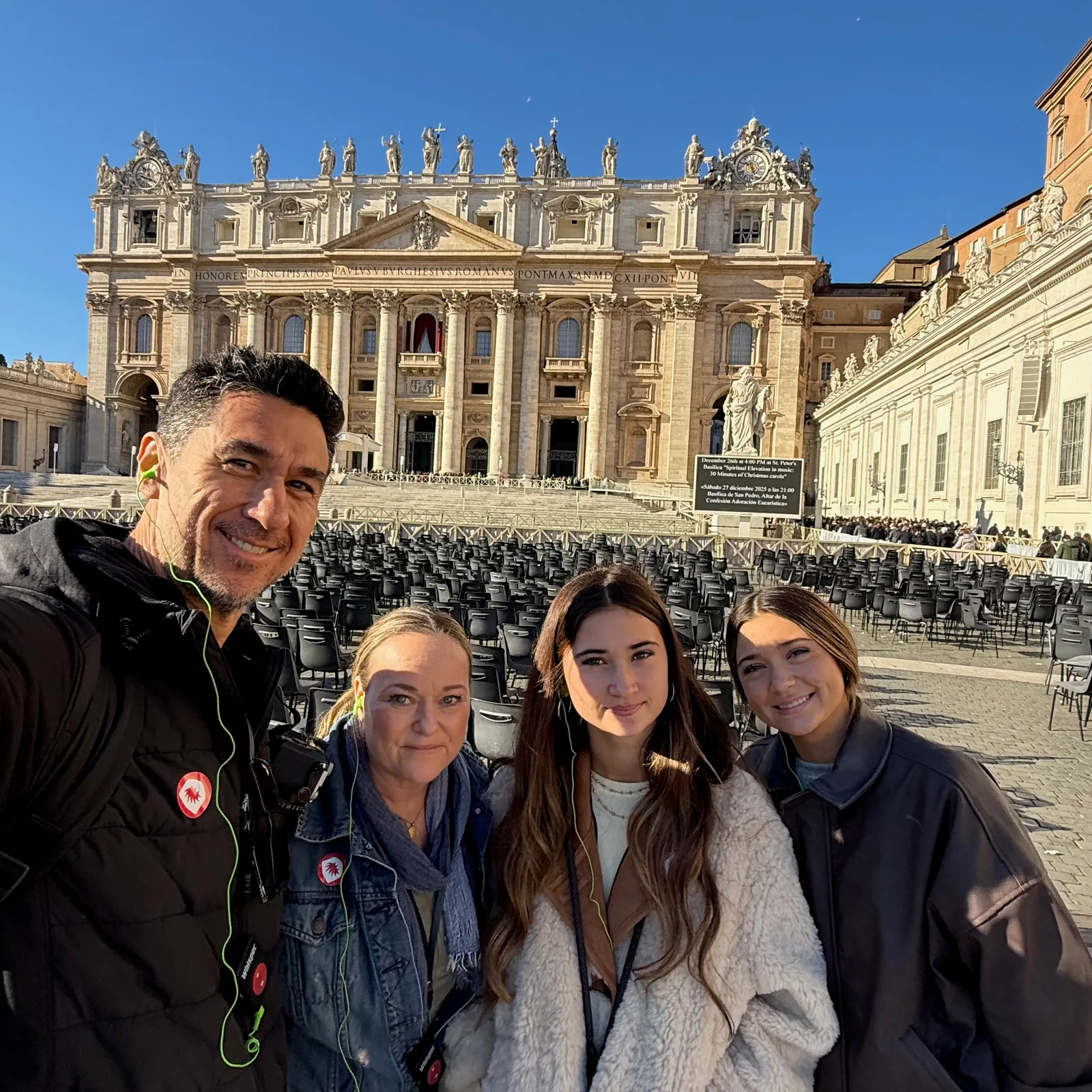 Josh and family in St. Peter’s Square with the basilica behind them