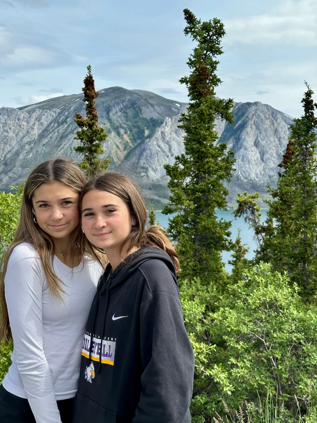 Family portrait with mountains and trees near Carcross