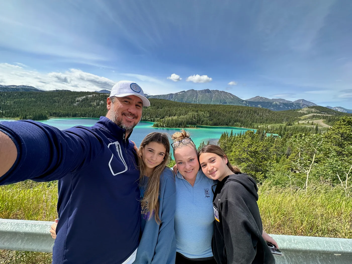 Family photograph overlooking a lake near Carcross
