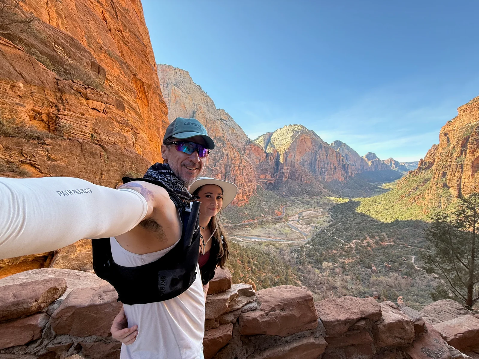 Josh and Lyla together overlooking the red-rock canyon in Zion