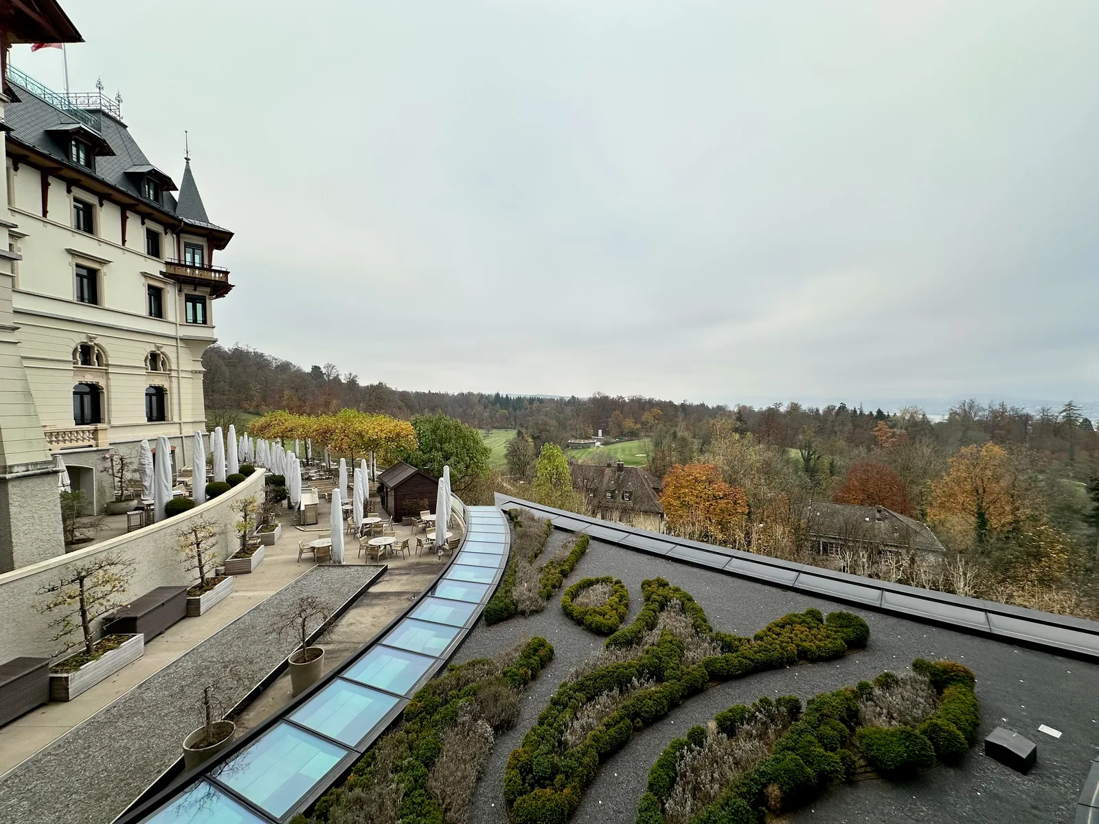 Terrace and garden overlooking autumn trees in Zurich